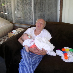 Hans takes a snooze with his granddaughter, Katie.