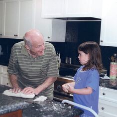 Opa teaches Sophia the art of dough kneading.