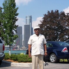 Harry in Windsor, Canada, with Detroit's Renaissance Center in the background