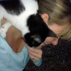 Heather making friends with a neighborhood cat (animals always adored her)