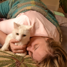 Heather snuggling with her cat Snowy