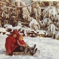 Sledding with her brother Rob