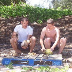 Heber and Kris cracking coconuts on the north shore of Oahu
