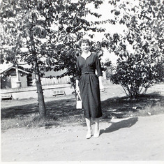 Helen Smyth at her childhood home ready to go to her first job downtown. 1021 12th Avenue, Anchorage, Alaska - 1955
