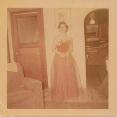 Helen Conover ready to attend the 1954 Prom. In the basement of her house at 1021 12th Avenue, Anchorage, Alaska. 