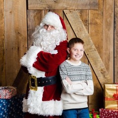 Caden with Santa....11 now, says this was his last year for santa pictures...lol