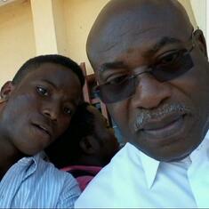 Daddy and his home assistant, Masango Ebanja