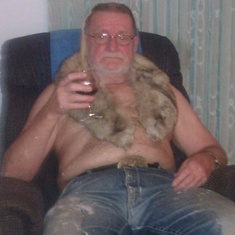 Gramps drinking wine with the fur off of one of grandma's old jackets.