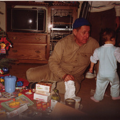 Grandpa with a busy girl, December 1988