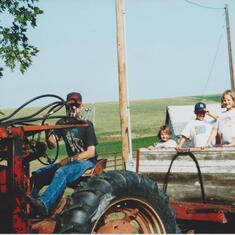 Papa giving out tractor rides