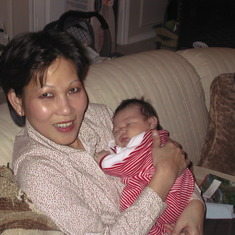 Christmas 2002, holding first grand-daughter, Emma.