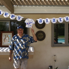 Howard and his 60th birthday banner