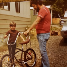 Rob Long with Dad. 7th birthday bike Dad built for him.