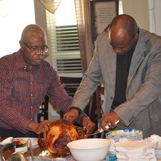 Okie and Daddy carving the turkey