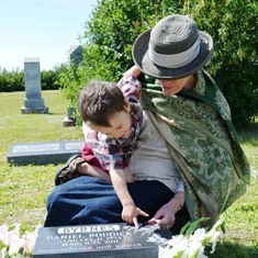 Jary with Hugh's great-grandson Daniel, looking at Dan Byrnes' grave