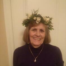 Wearing her floral crown