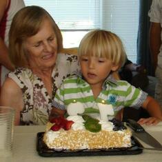 Nathan helping Great Nanny blow out the candles
