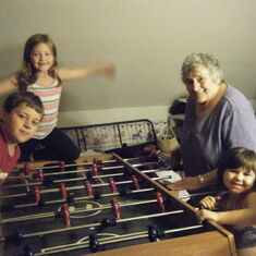 Playing fooseball with her grandkids
