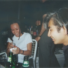 Irene and Takeshi amusing each other, Cheryl's Roof Party, 2000