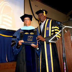Mom posing with Dr. Herbert Thompson at her graduation - 2010