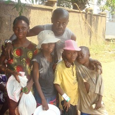 Ivan with the Street children he adopted to provide support for their education
