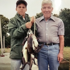 Jacob Larry Short, grandson of J.C. Short at the Powderly, TX farm with channel catfish caught at the farm pond