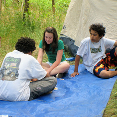 Enjoying a card game on the tarp at Cave Springs Camp Ground, AZ