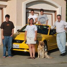 Allen family with dad's bright new car, 2004