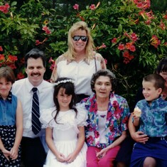 First communion with his family, sister Gail, niece Danielle, and mother, Kathleen, 1996