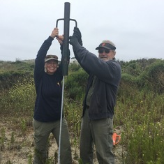 Colleen and Jack sinking poles for haul out area in Moss Landing 
