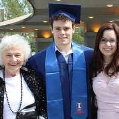College graduation with his grandmother and sister