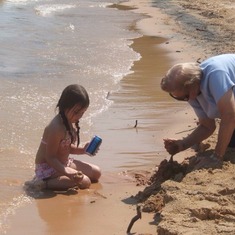 Granddaughter, Payton and Grandma (Lala) Meyer building sand castles.
