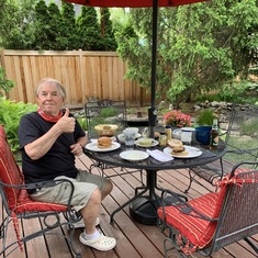 Enjoying dinner in our backyard