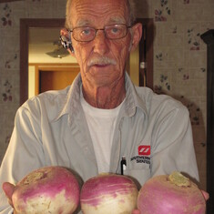 dad holding the turnips him and papaw grew
