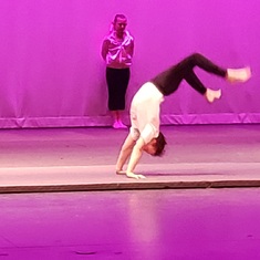 Raymond at his dance recital doing a somersault. 2021