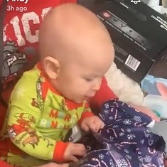 Ruby opening her first Christmas gifts