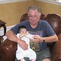 Jack with his first adopted grandchild, Mia, who was born in Kazakhstan.