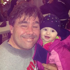 Carmela with a sweaty daddy after one of his 5Ks.