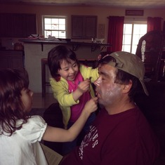 Such a good daddy, letting his girls put makeup on him.