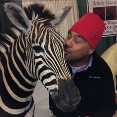 At a trade show for work. Ava loves zebras.
