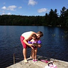Ava with daddy fishing at camp.