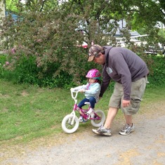 Ava learning to ride without training wheels.