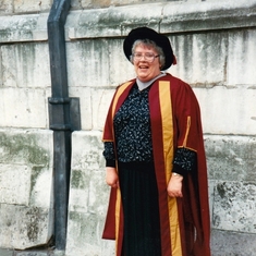 Jacqueline triumphant in her PhD gown 