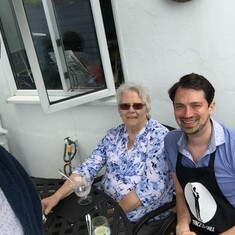 Jacqueline enjoying a BBQ with her nephew Philip and partner Michael in 2017