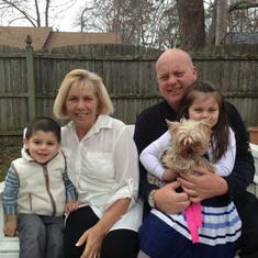 Jackie with her husband, two of her grandchildren, and dog Chloe
