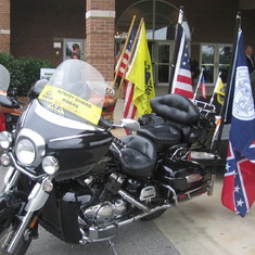 Patriot Guard Riders carry the stars and stripes as well as the Georgia flag.