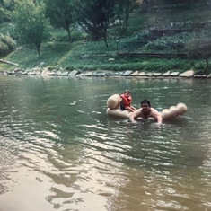 Brian with his son Brian Douglas Hatcher floating around the pond at the cabin, at Shady Oaks.