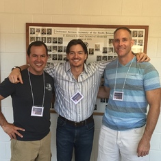 Dave, Pete Silvero, & Tom Kolkebeck in front of their class wall at USUHS 20th reunion (2015)