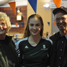Mom and Dad with Audrey after a swim meet