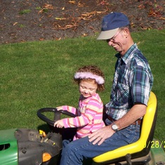 Dad showing Jordin how to mow the yard